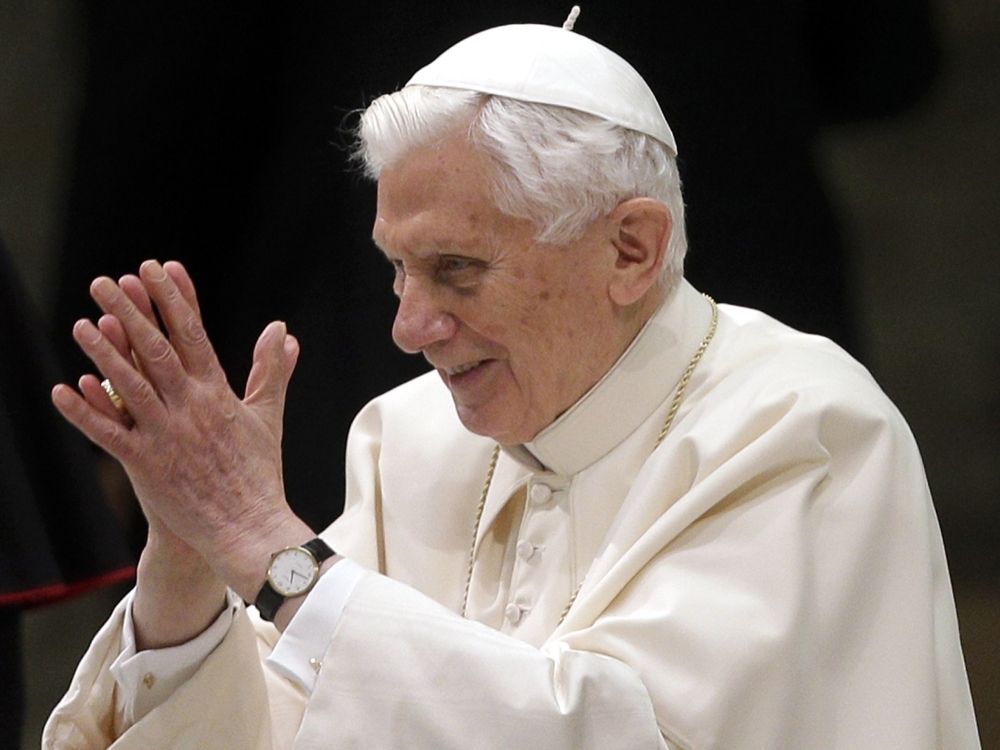 Pope Benedict XVI arrives for his weekly general audience at the Paul VI Hall at the Vatican, Wednesday Feb. 13, 2013. Pope Benedict XVI is telling the faithful in his first public appearance since announcing his resignation that he stepping down for "the good of the church." Benedict received a lengthy standing ovation when he entered the packed audience hall Wednesday. He was interrupted by applause by the throngs of people, many of whom had tears in their eyes. At the start of his audience, he repeated i