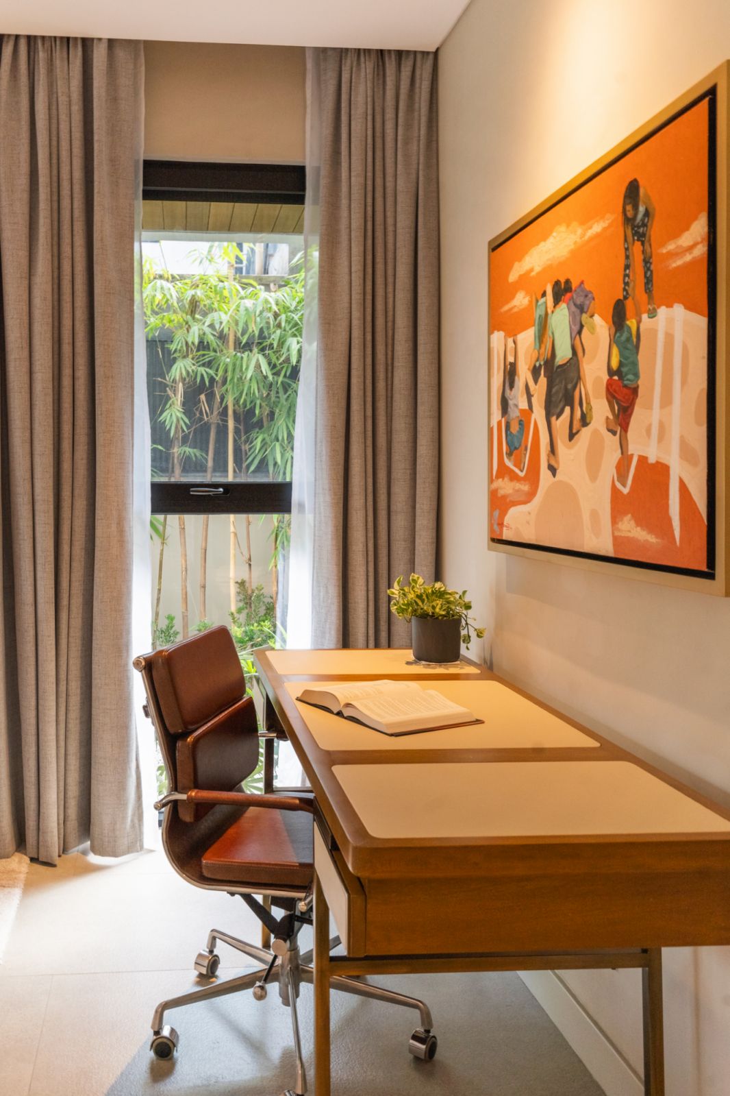 A desk in a bedroom overlooking the main garden at a family home in Malabon, Manila