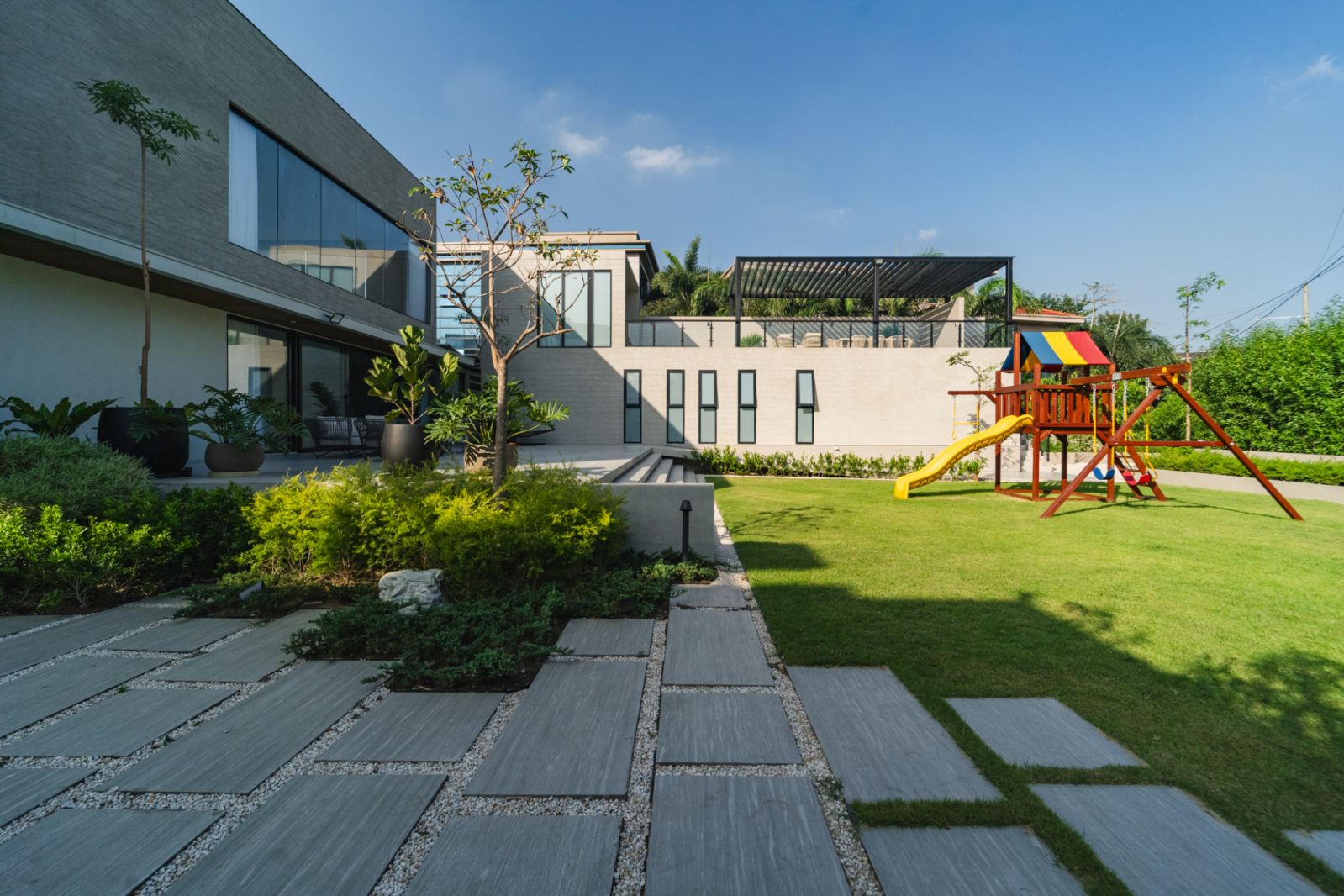 The outdoor area with a playground at a family home in Malabon, Manila