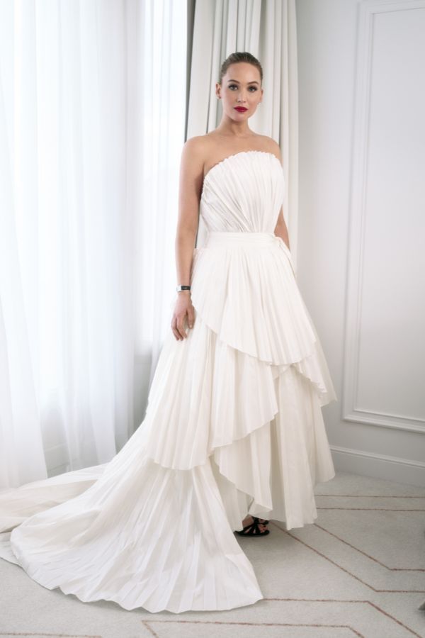 Jennifer Lawrence wears a re-interpretation of the famous Dior 1949 Francis Poulenc gown in accordion-pleated silk taffeta