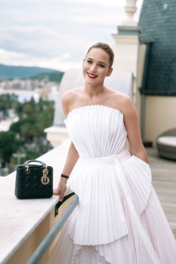 Jennifer Lawrence wears a re-interpretation of the famous Dior 1949 Francis Poulenc gown in accordion-pleated silk taffeta