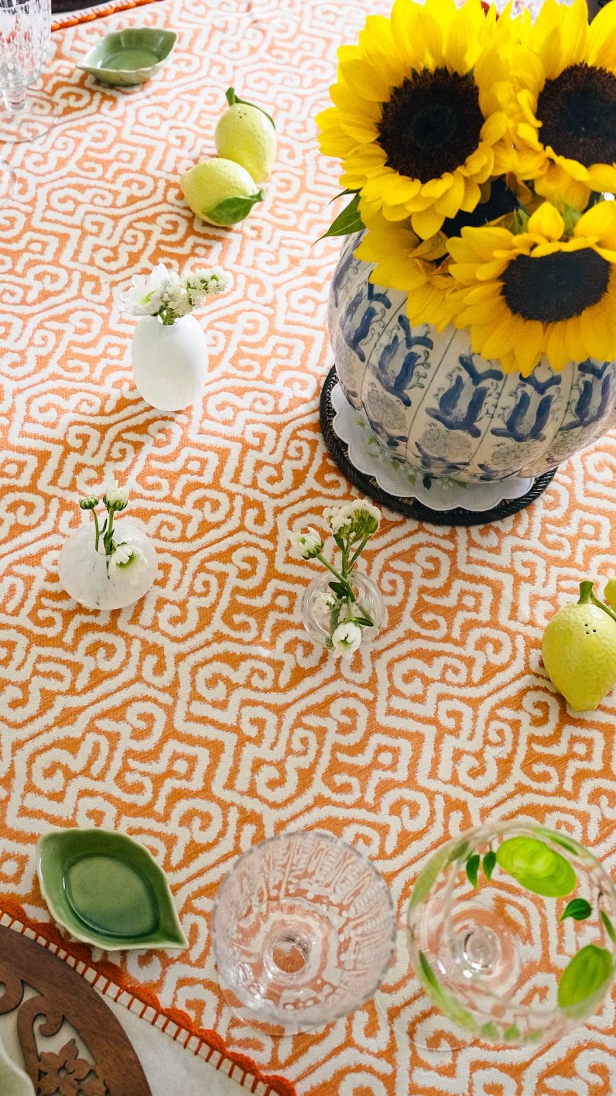 Bud vases sprinkled on the table add a gentle sophistication to the tablescape by Techie Hagedorn