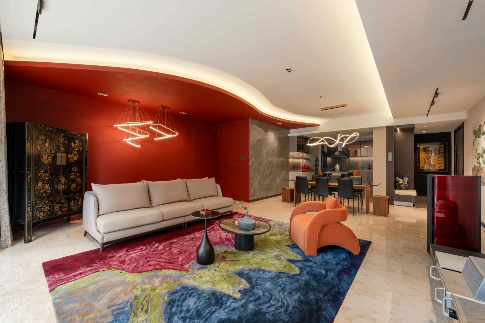 A sculptural ceiling envelops the living space, adding movement, depth, and layering