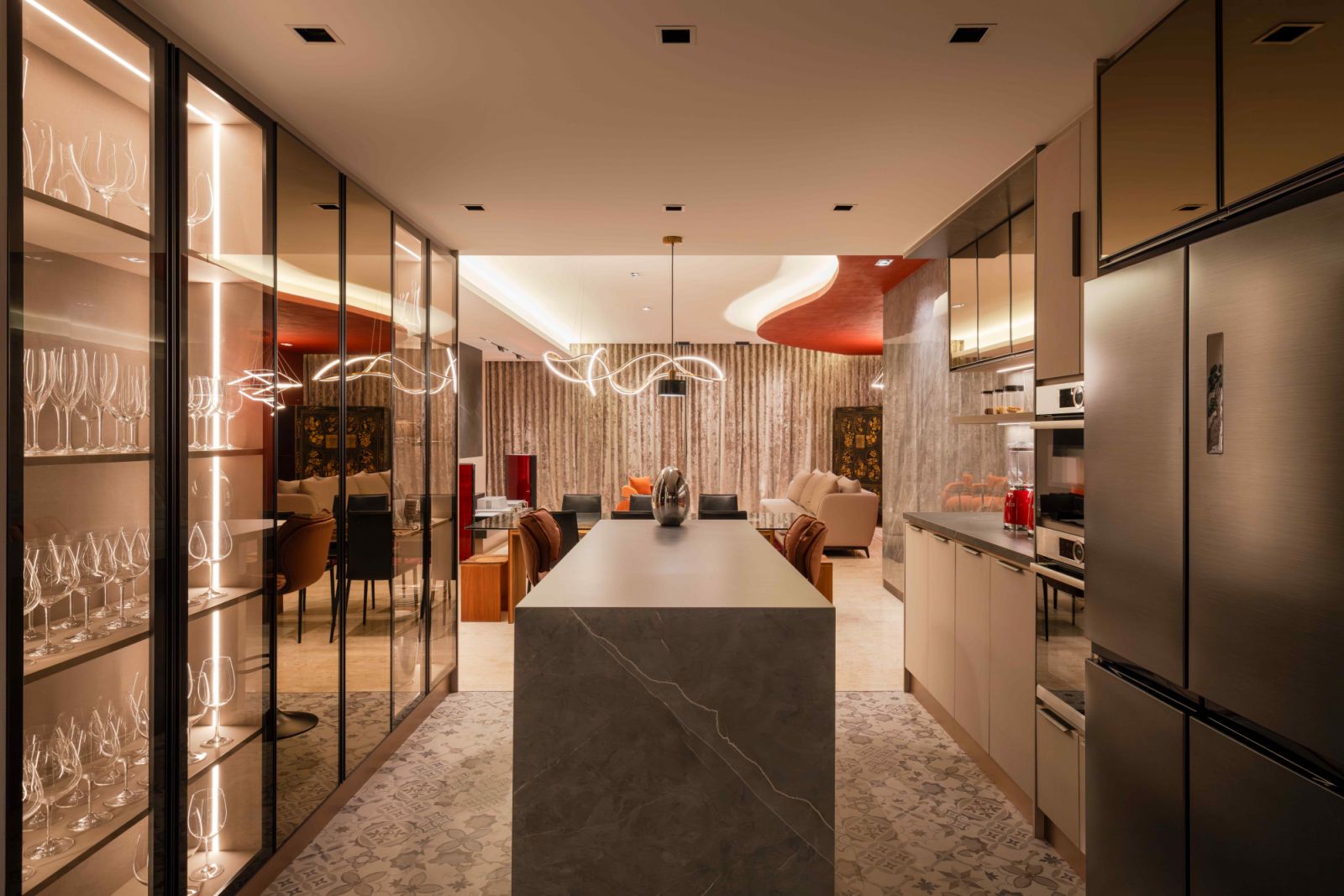 The kitchen features a grey-toned marble kitchen counter, Moroccan-patterned flooring, and cabinetry with tinted glass