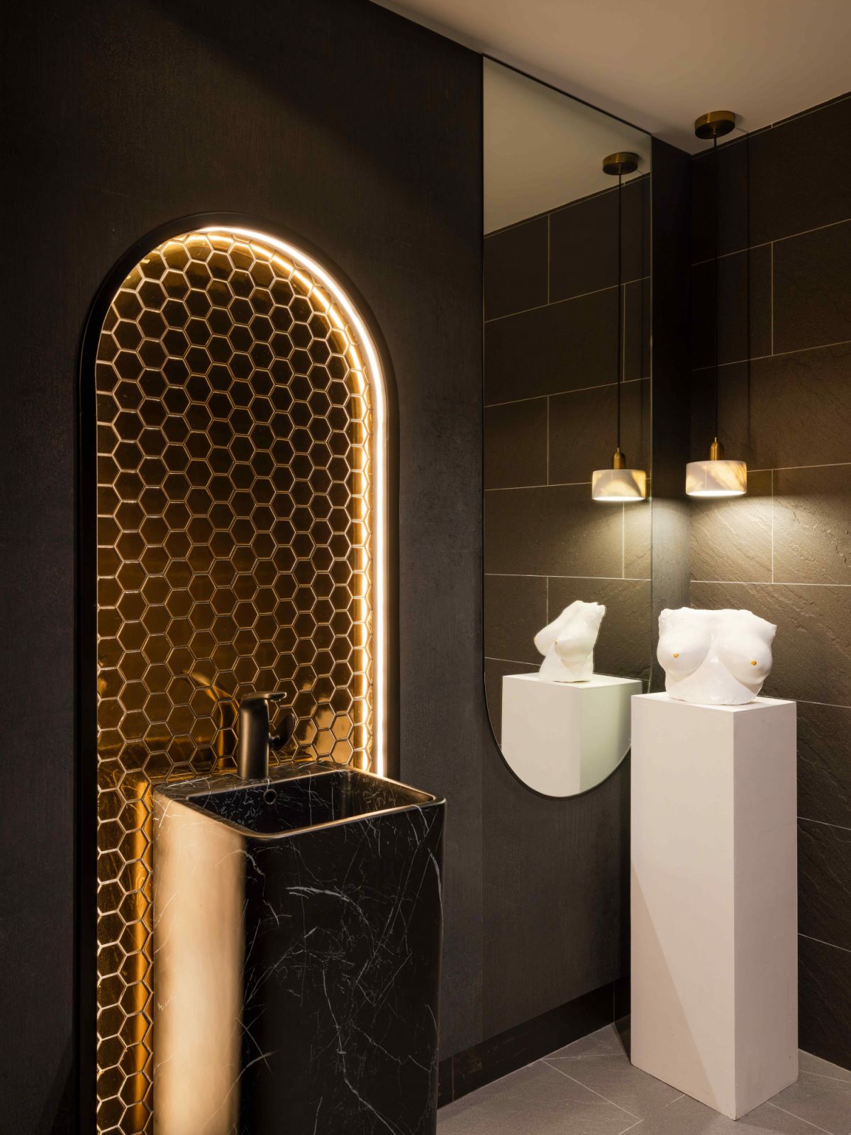 Luxurious materials and calm ambient lighting further elevate the spa-like experience