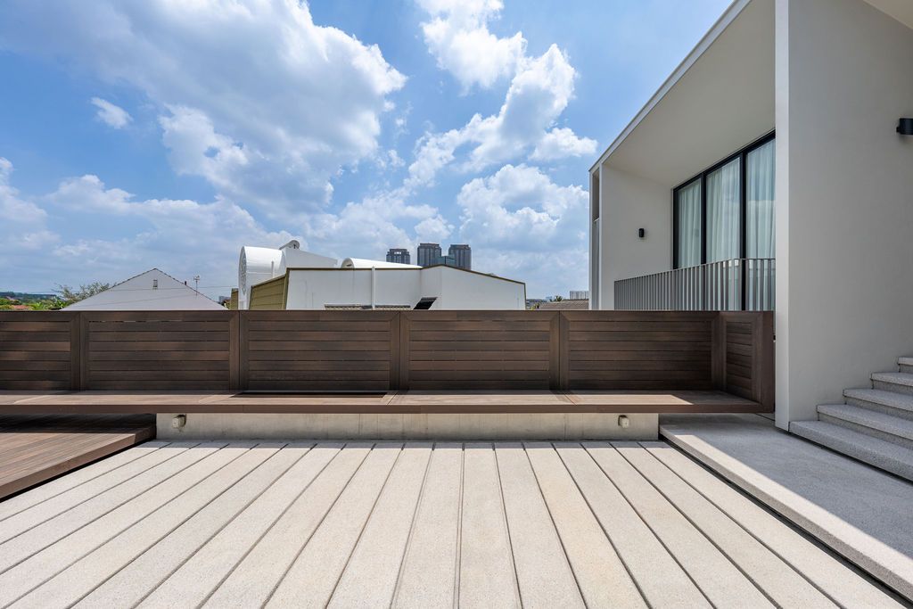 The roof terrace extends from the upper level family room, providing resort-style villa living