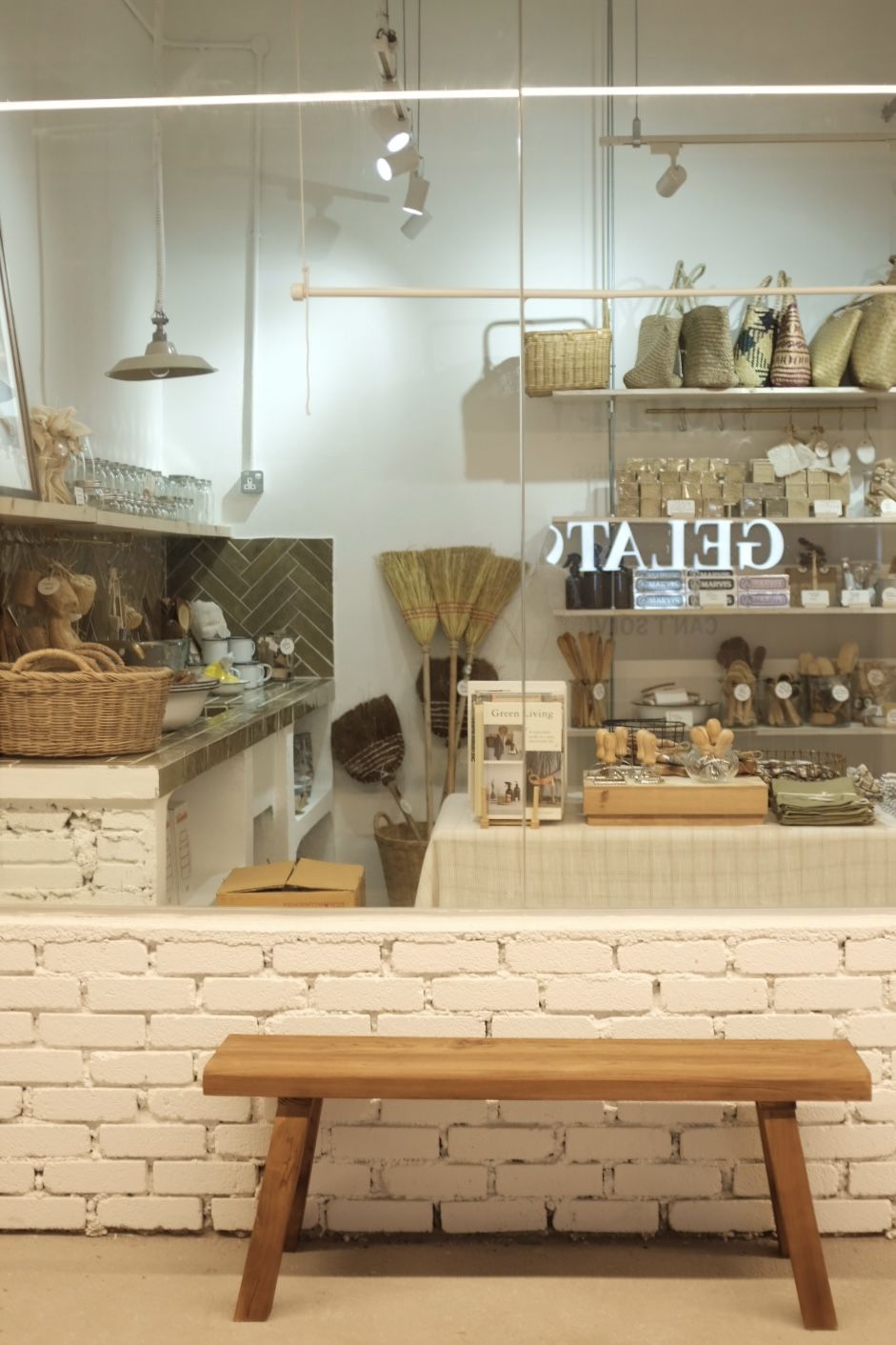 Uneven brick wall and large windows reminiscent of vintage European storefront