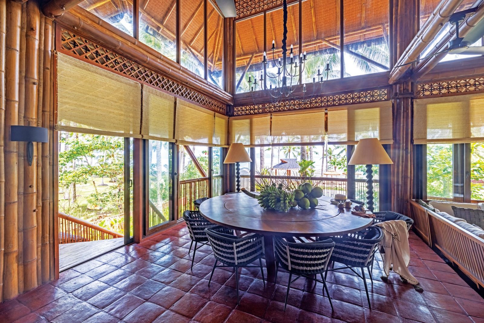 The dining area at Aman Sinaya on Mati Island, Mindanao with a customised dining table by Grosswood surrounded by A Garcia Chairs