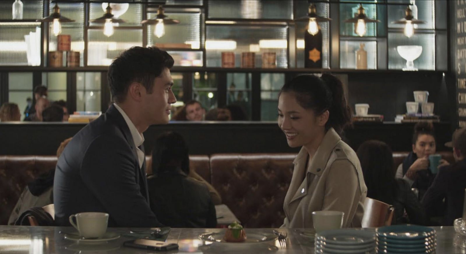 Constance Wu and Henry Golding in “Crazy Rich Asians” (Credit: IMDb Photo courtesy of Warner Bros. Pictures - © 2017 Warner Bros. Entertainment Inc. All Rights Reserved.)