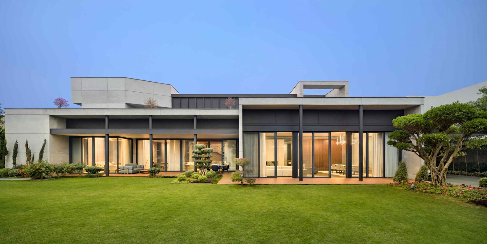 Courtyard House is a striking fresh take on a contemporary luxury home set against lush greenery