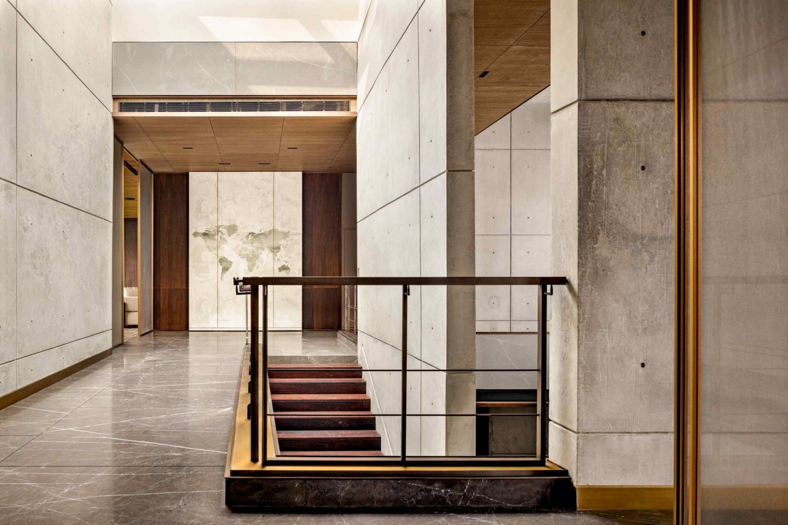A combination of locally sourced stone, natural wood, and exposed concrete