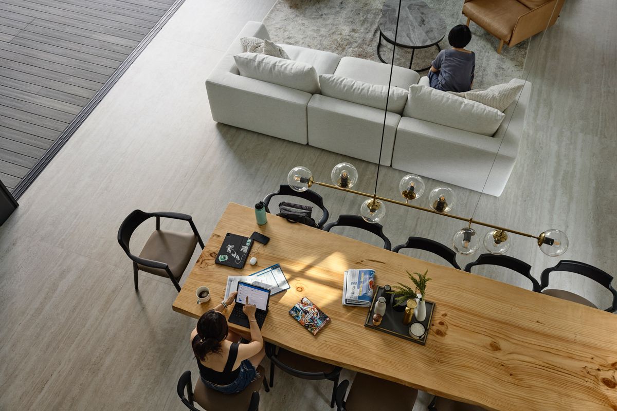 The bungalow's common area features a fluid layout between living and dining spaces, designed to encourage family interaction