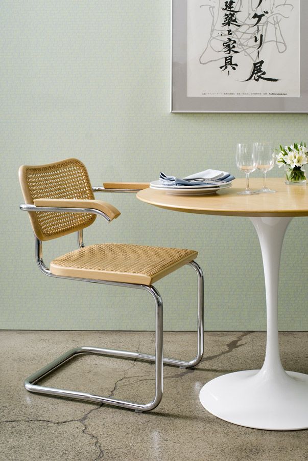 A classic Cesca chair showcases Marcel Breuer’s revolutionary cantilever design, featuring hand-woven cane seat and backrest paired with polished chrome tubular steel frame (Photo: Knoll)