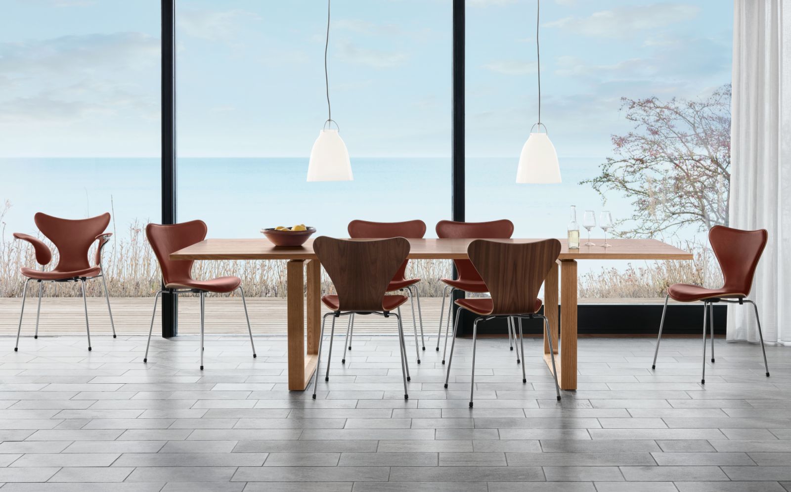 The Series 7 chairs by Arne Jacobsen have a revolutionary moulded plywood construction and elegant silhouette (Photo: Fritz Hansen)