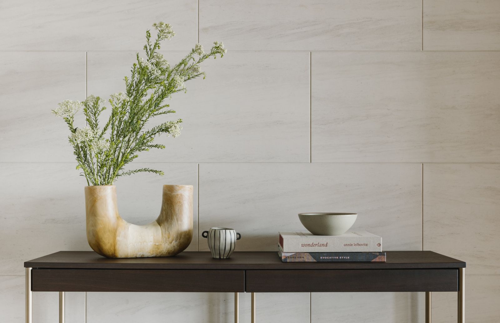 In the entryway, sculptural objects and handcrafted details welcome with quiet poetry—setting the tone for a home grounded in intention