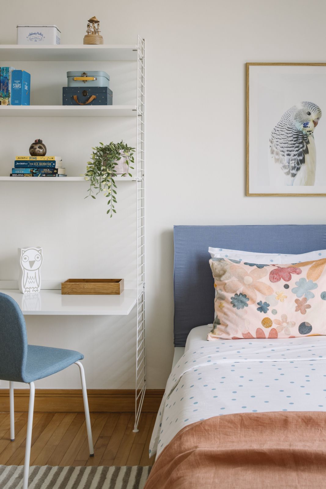 In the children’s room, cheerful pattern play meets function, with a compact shelving-and-desk unit that holds trinkets, toys and treasures from everyday life