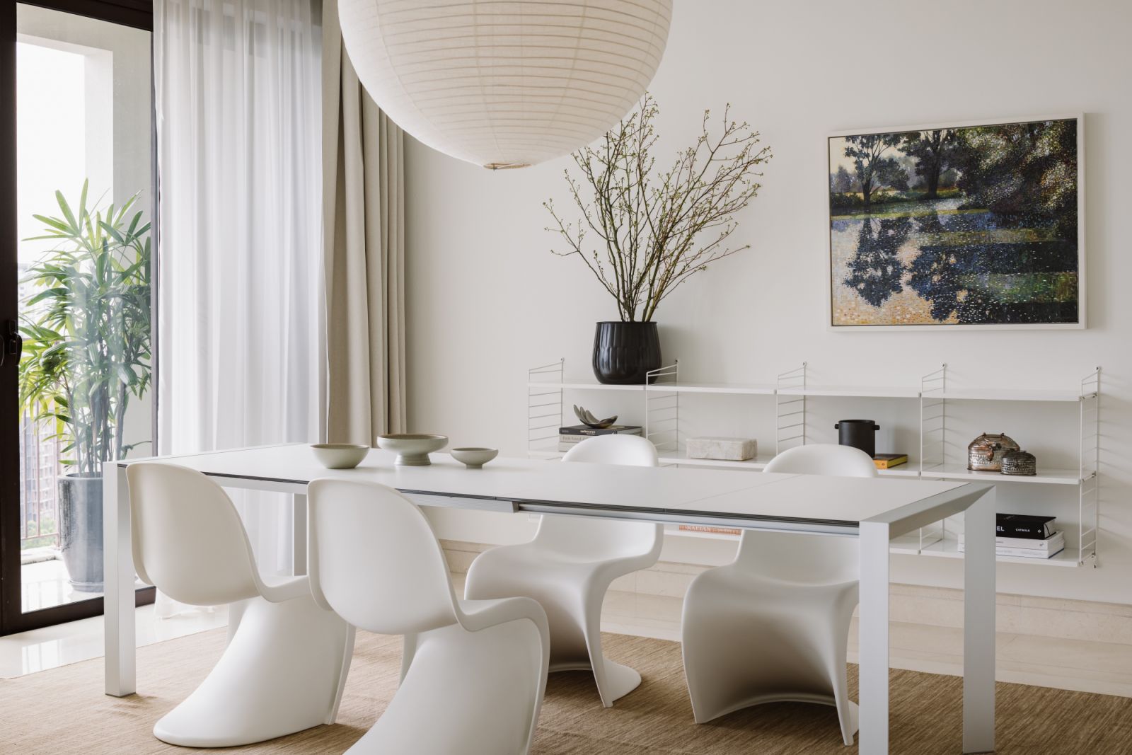 Airy and restrained, the dining zone is designed for intimacy and ease—highlighting a dialogue between soft natural light, organic lines and thoughtful styling