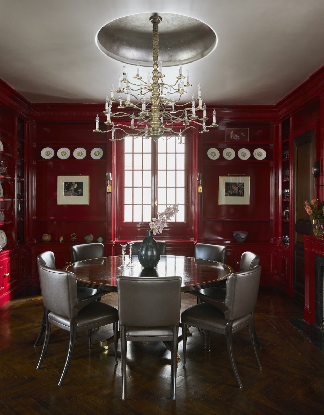 The dining room at a home on Park Avenue, New York, designed by Phillip Thomas, with a custom circular table from John Boone and a restored chandelier from the owners' previous home,