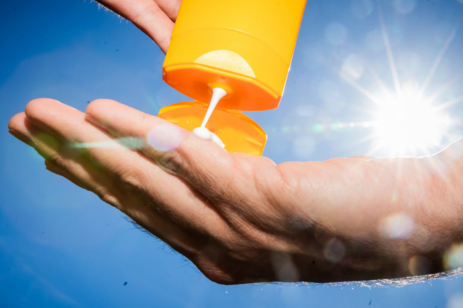 ILLUSTRATION - 21 May 2025, Berlin: A man pours suntan lotion from a tube into his hand. (Staged scene) Photo: Christoph Soeder/dpa (Photo by Christoph Soeder/picture alliance via Getty Images)