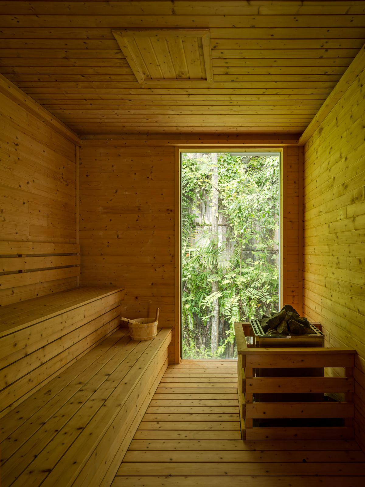 The sleek wooden sauna offers a tranquil retreat on the second floor, complementing the home’s wellness-focused design philosophy