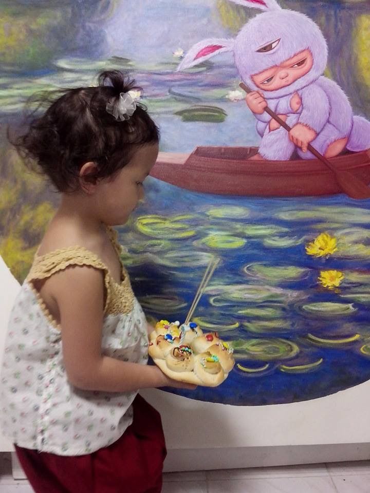 Young Mardi wandering through her father’s exhibition