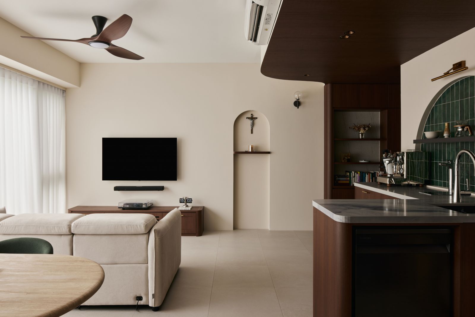 Natural light floods the living area, where warm wood finishes and a neutral palette heighten the sense of calm and connection to nature