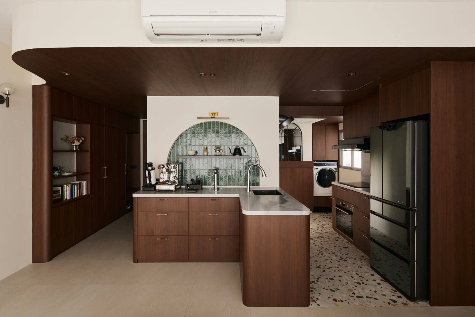 In the heart of the home, the arched green-tiled backsplash creates a striking focal point—adding depth, tactility and a subtle rhythm to the kitchen
