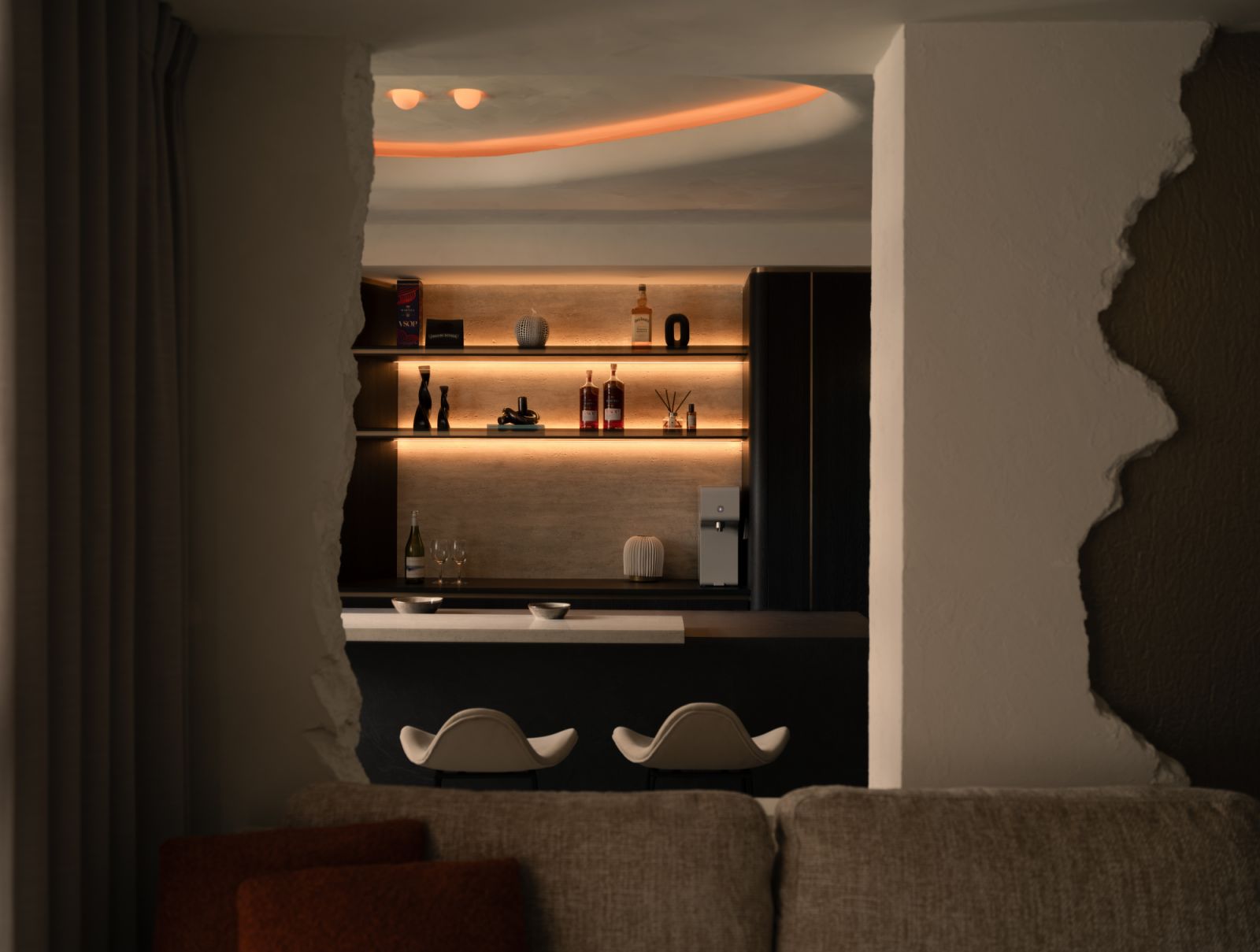 A dramatic cut-out frames the view into the dry bar, where warm cove lighting and curated shelves invite intimate moments of relaxation and conversation