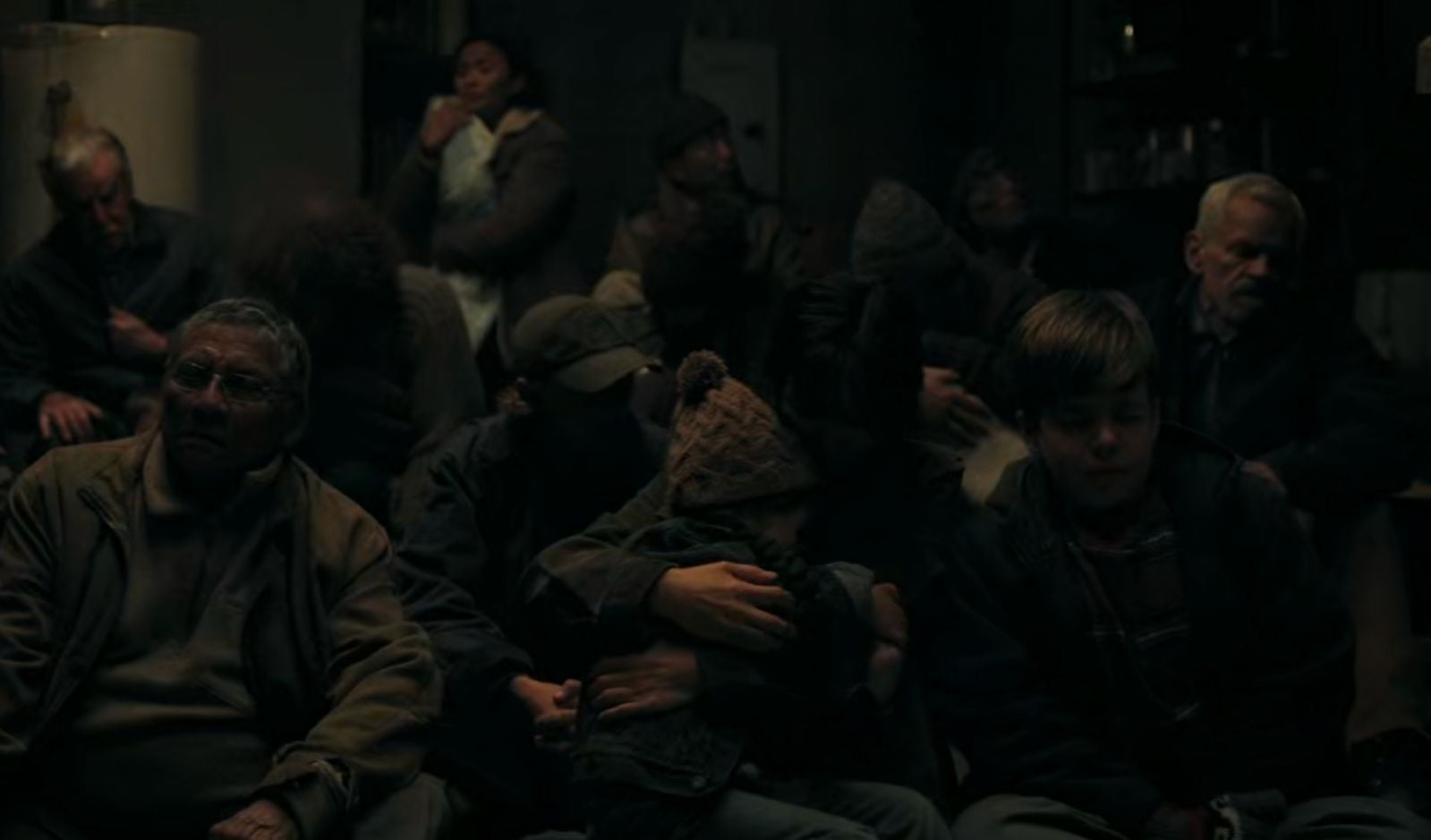 Frightened Jackson citizens hiding in basement shelters in ‘The Last of Us’ (Photo: HBO Max)