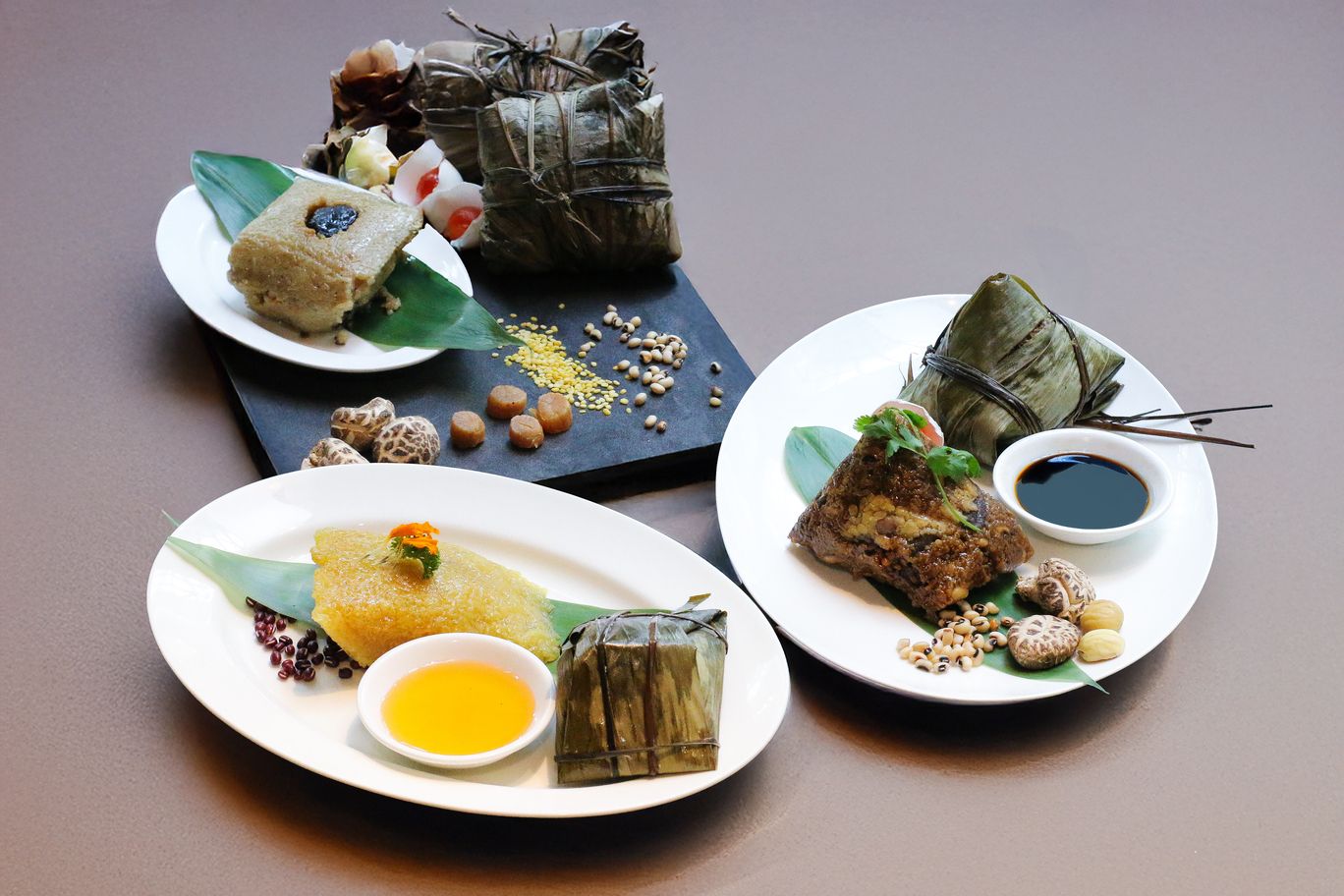 Steamed Sweet Glutinous Rice Dumpling with Red Bean, Traditional Steamed Rice Dumpling with Baby Abalone & Five Spice Rice Dumpling with Pork Belly (Photo: Grand Millennium Kuala Lumpur)
