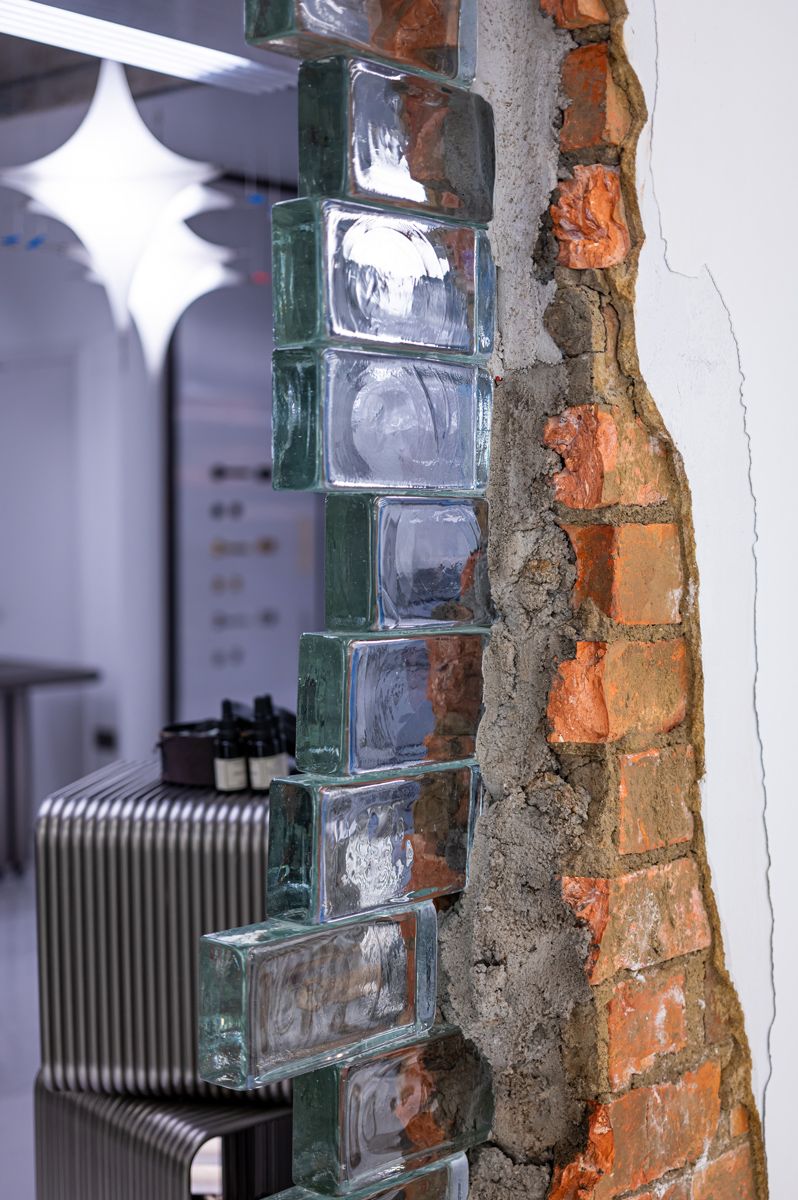 The passage between 397 and 399 units at Sol Luminaire has been artfully articulated with bricks old and new by Typeface