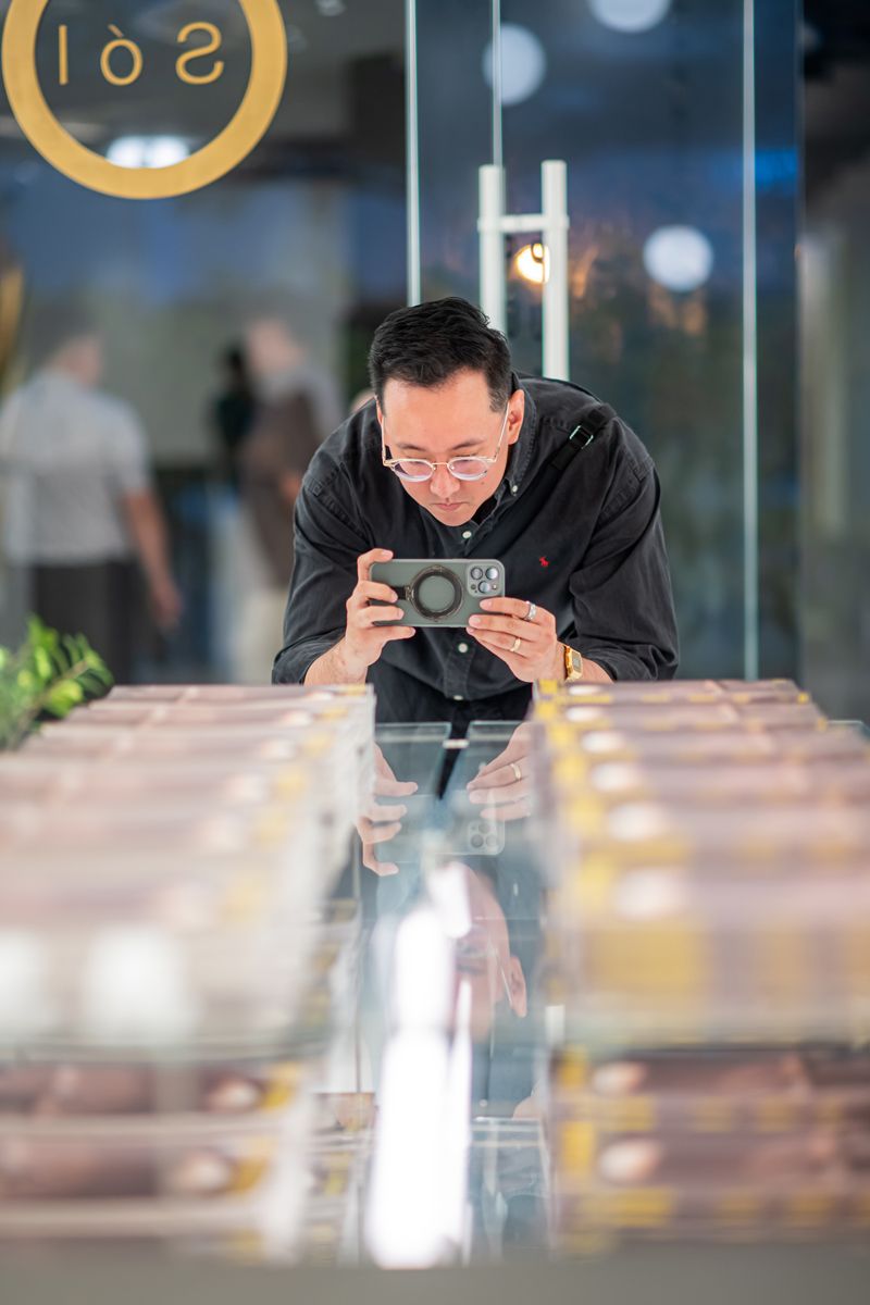 A guest taking picture at Sol Luminaire showroom at 395 Guillemard Road