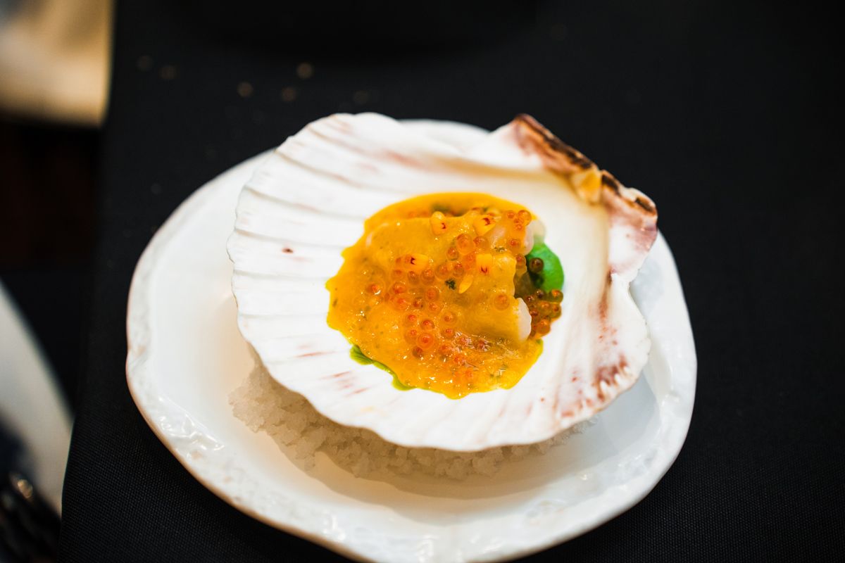 Amuse-bouche: hokkaido scallop crudo, mango, trout roe, sawtooth coriander oil