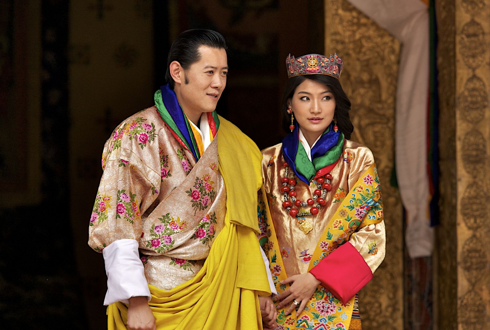 King Jigme Khesar Namgyel Wangchuck and Queen Jetsun Pema, walk out after their marriage ceremony is completed in Punakha, Bhutan. The Queen is seen here wearing The Phoenix Crown (Photo: Triston Yeo/Getty Images)