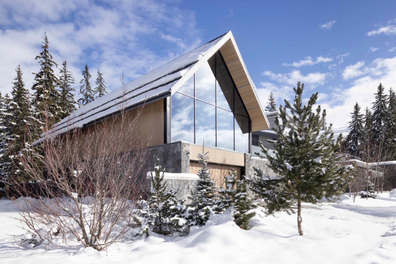 A distinctive pitched roof with steel structural moment frames to support the seismic and heavy snow loads