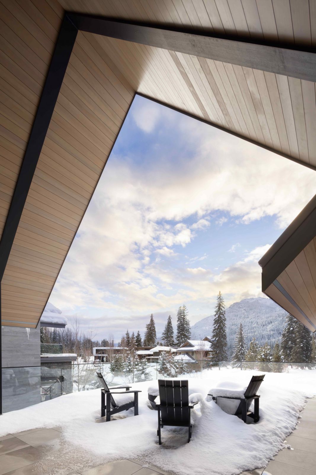 The heated covered deck overlooks the distant mountains