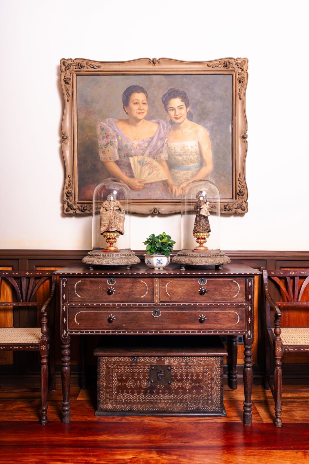 A Fernando Amorsolo painting of the homeowner's mother and grandmother on display by the bar area of a heritage home, Casa San Rafael, in the city of Parañaque, Metro Manila, Philippines