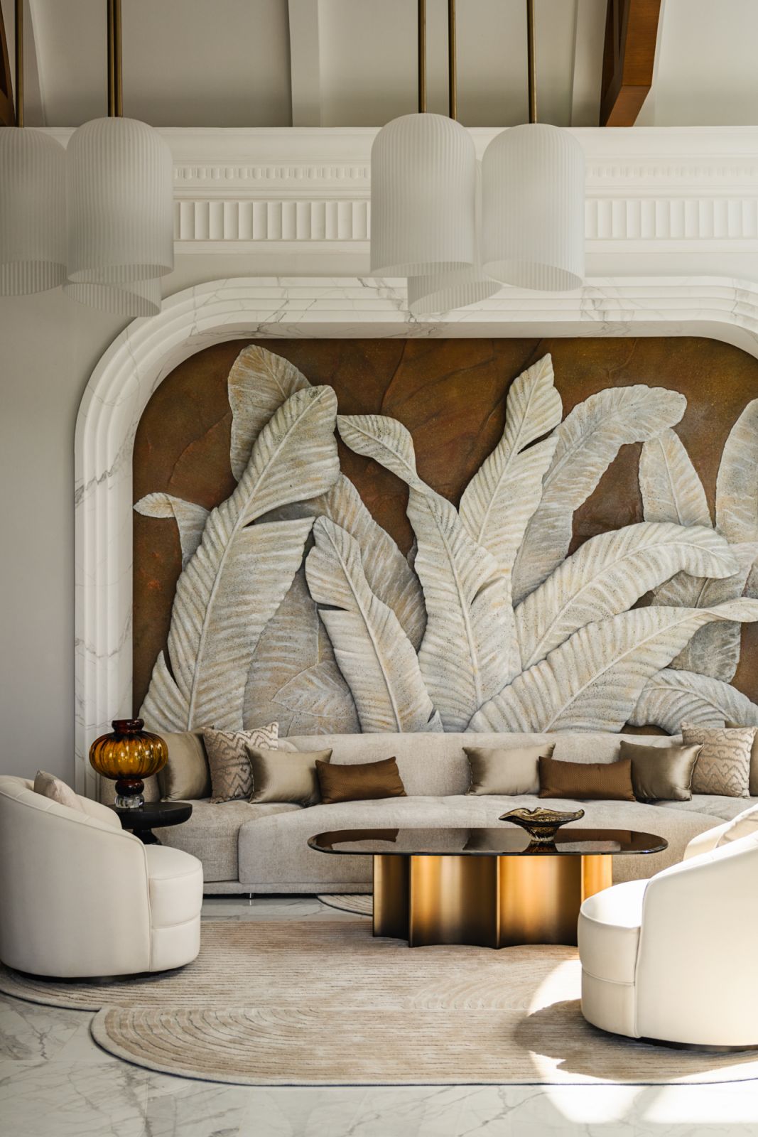 A kinetic banana leaf bas-relief in the foyer greets visitors with texture and movement