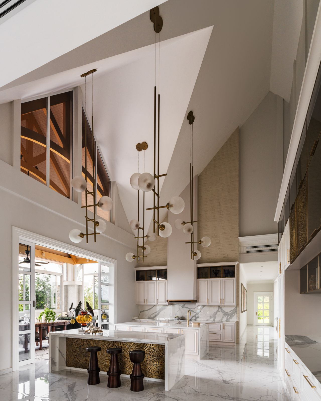 In the kitchen, slanting planes reference traditional English gabled roofs while maintaining a distinctly modern sensibility