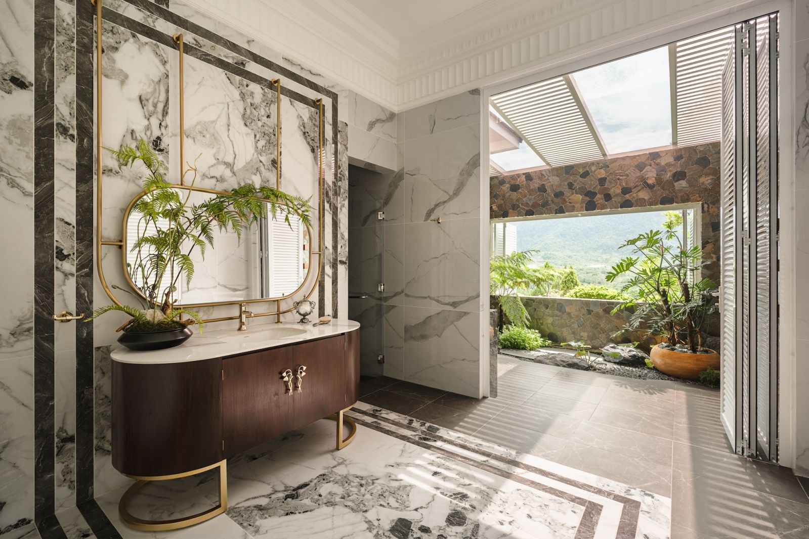The bathroom is a serene personal sanctuary that complements the breathtaking natural setting of this residence