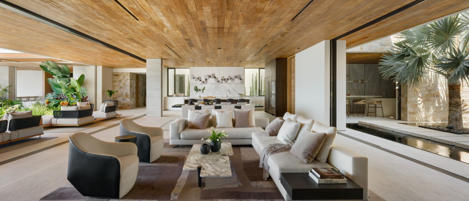 The open-plan living areas with calm reflective water features (Photo: Rafael Gamo)