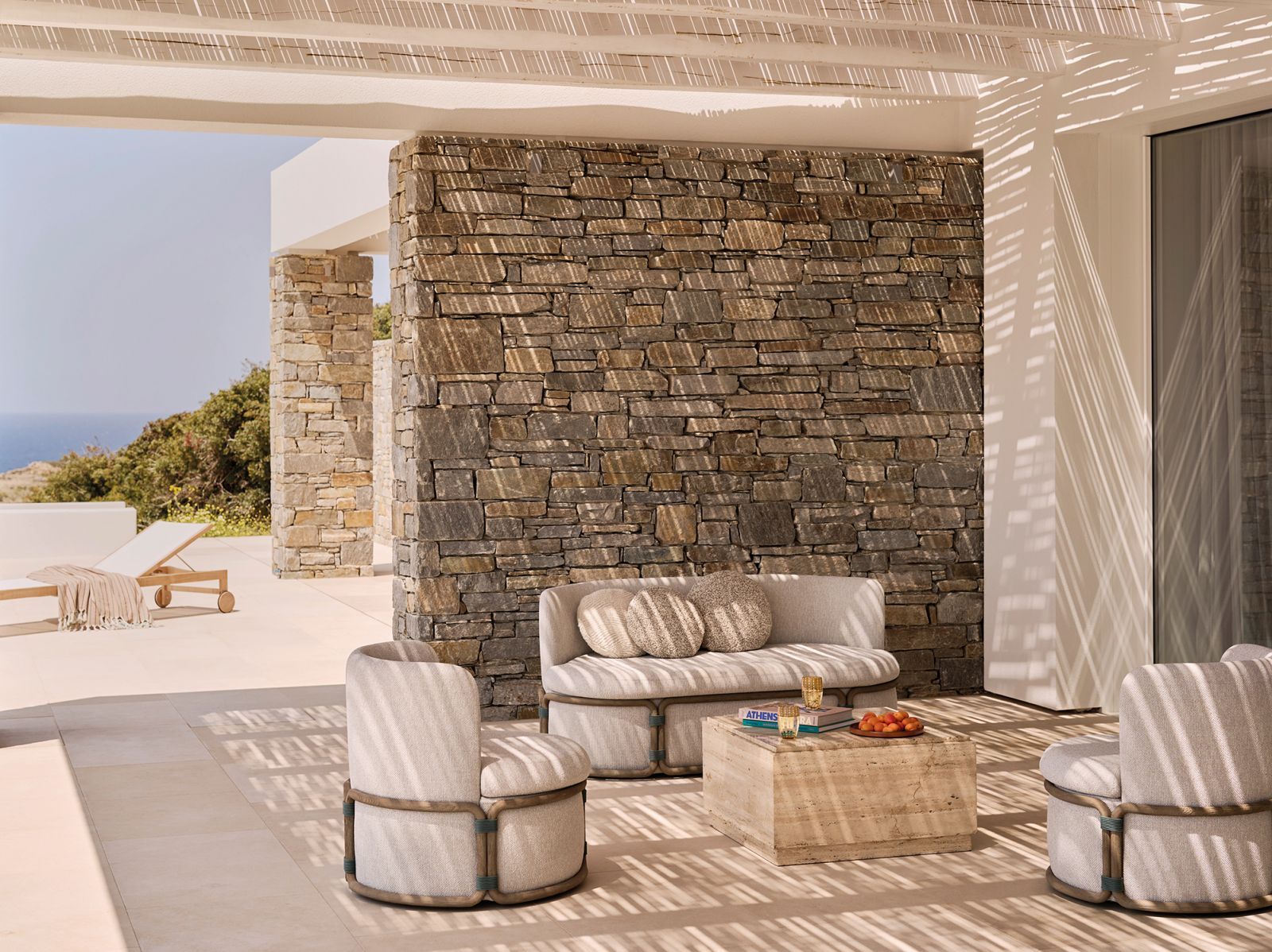 Locally sourced shale rock forms striking pergolas that shield terraces from the harsh Cycladic elements (Photo: Alexis Armanet)
