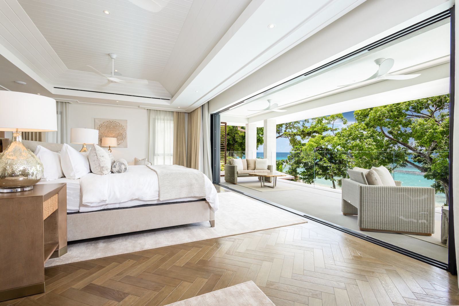The beachside villa maintains privacy and understated elegance (Photo: One Caribbean Estates)