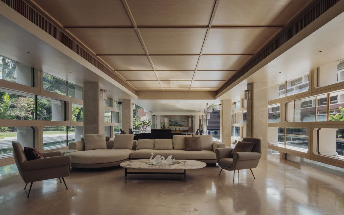 The Moongate House’s living room is dressed in a neutral colour palette
