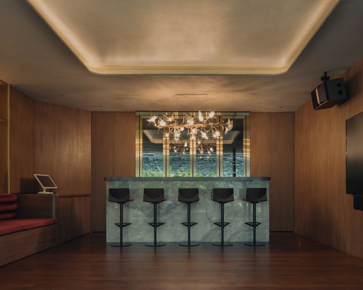 The karaoke room is anchored by a stylish bar