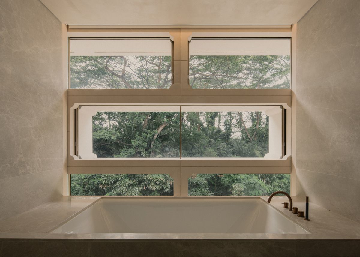 The concrete-block module as seen from a serene bathroom
