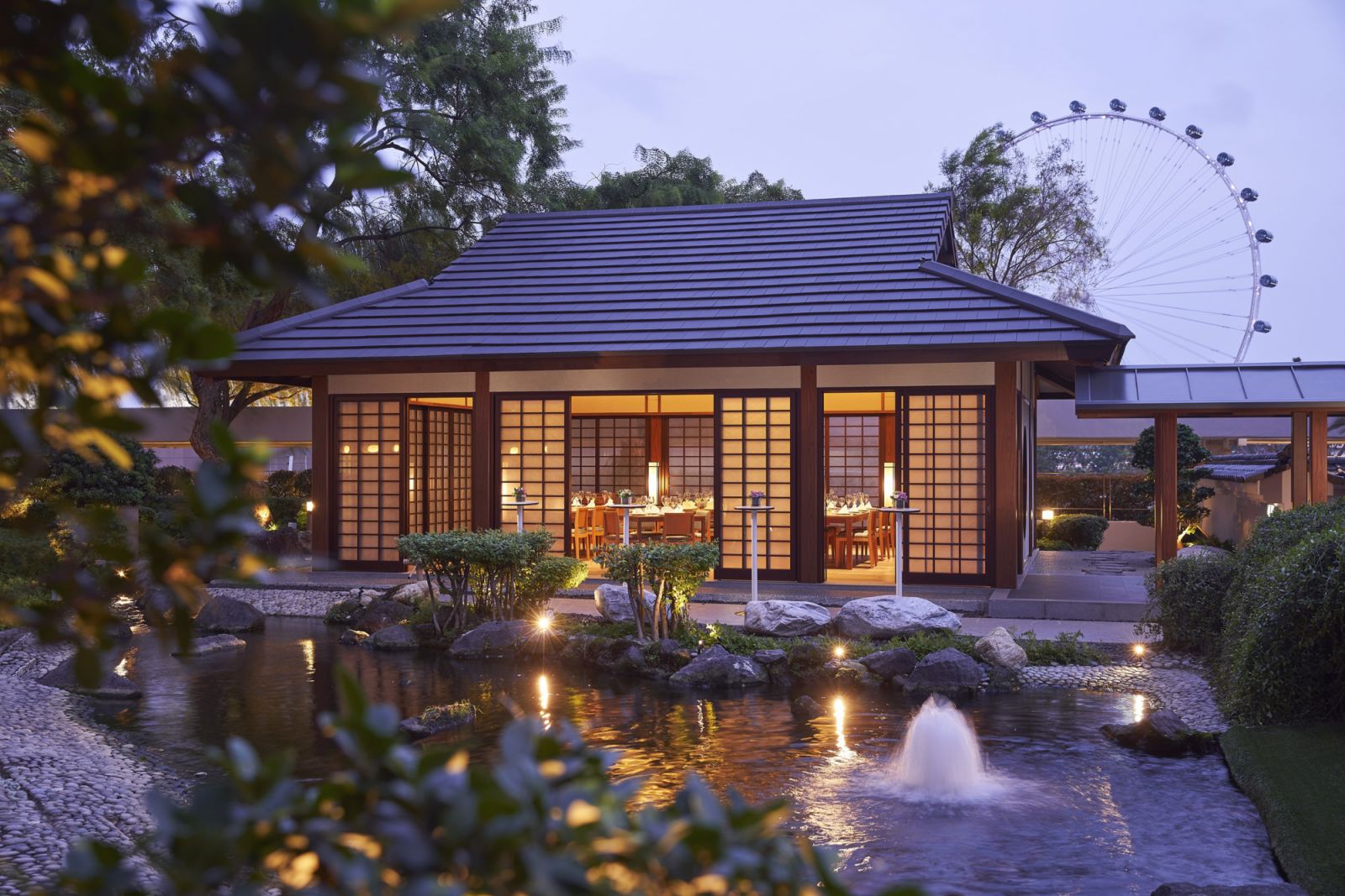 The garden pavilion at Keyaki offers a serene backdrop for intimate dining, nestled beside a koi pond with city views beyond