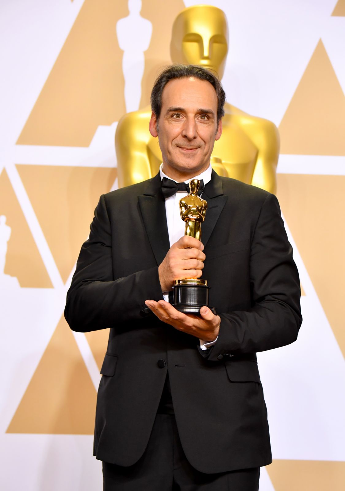 HOLLYWOOD, CA - MARCH 04: Composer Alexandre Desplat winner of the Best Original Music Score for "Shape of Water" poses in the press room during the 90th Annual Academy Awards at Hollywood & Highland Center on March 4, 2018 in Hollywood, California. (Photo by Jeff Kravitz/FilmMagic)