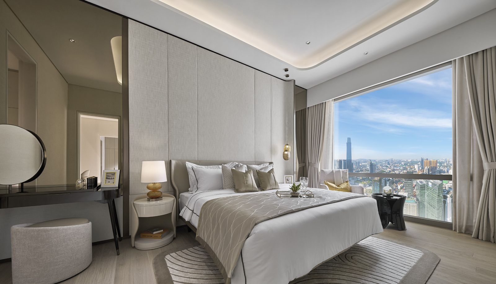 The master bedroom maintains comfortable proportions without compromising communal areas, featuring floor-to-ceiling windows that frame Kuala Lumpur’s skyline