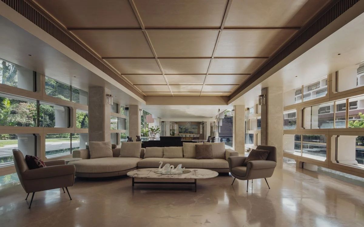 The Moongate House’s living room is dressed in a neutral colour palette